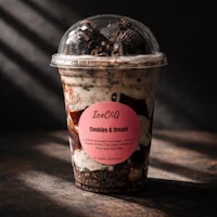 a cup of ice cream with cookies and cream in it